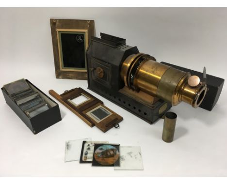 A magic lantern with slides. "The Praestantia"" made by Riley bros of Bradford. Complete with wooden slide bracket, box of mi