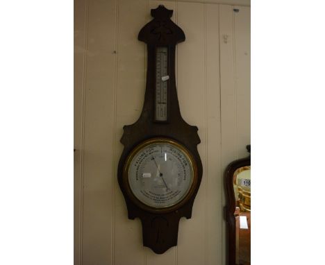An Oak barometer with a silvered dial the dial with the inscription Boatman Southend,