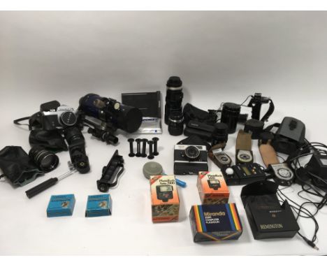 Mix of cameras and lenses including Soligor 35mm and Ricoh 500 ME cameras, Soligor and Miranda lenses, Polaroid back and film