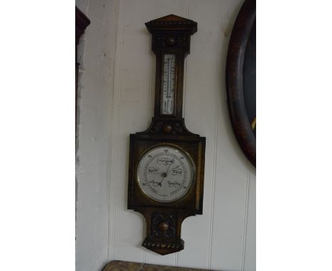 An Oak Wall Barometer with fitted silver dial