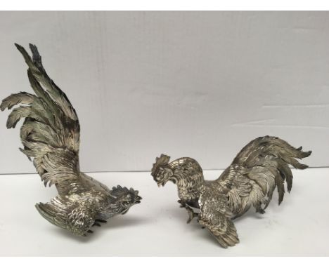 A pair of well detailed sterling silver cockerels, each marked sterling 925.Approximately 22cm high.