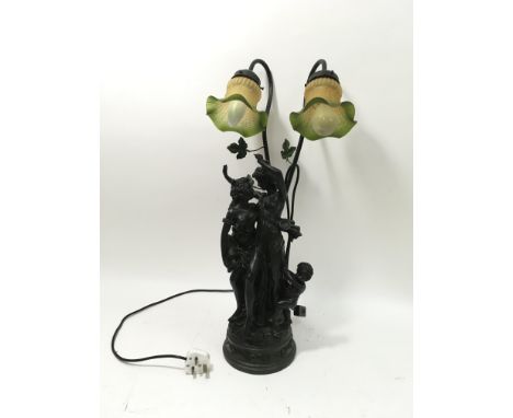 A large resin electric lamp with 2 shades, the base depicting two maidens and an infant.