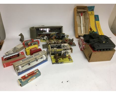 Included is a number of items, including model boats one of which is dinky, a corgi rocket, tanks and Britain’s items.