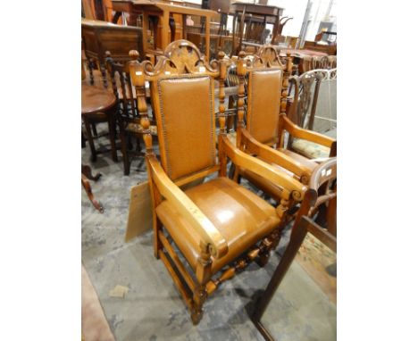 Pair of 20th century oak carver chairs with arched back top rail, bobbin turned uprights, faux-leather seats, on square and b