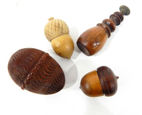Carved coquilla nut of ovoid form with geometric band decoration, two sewing reel and needle cases carved in the form of acor