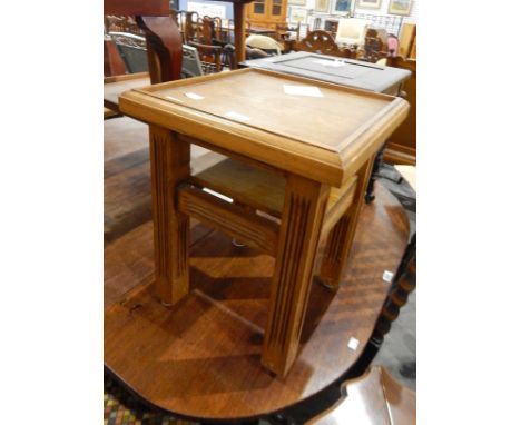 Early 20th century walnut envelope fold-over card table with green baize lined top and with counter wells to flaps, on slende