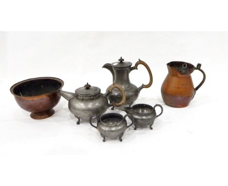 Pewter four piece teaset of circular hammered form, an Arts & Crafts hammered copper jug, a copper bowl, an aneroid barometer