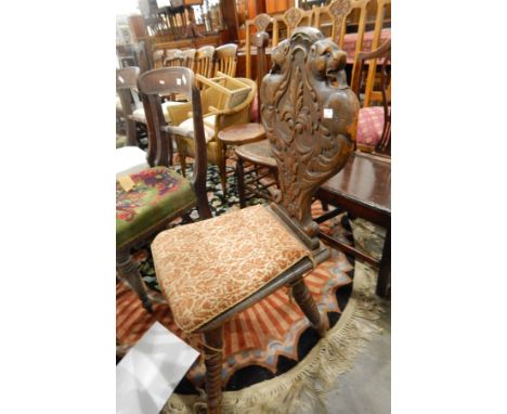 Victorian oak hall chair with lion, floral and scroll carved, shaped back on bobbin turned supports 