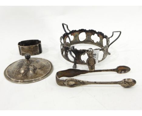 Two silver wine labels, one for whiskey and one for gin, a silver napkin ring, a pair of Victorian silver sugar tongs, a silv