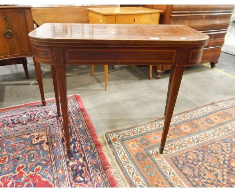George III mahogany folding card table with boxwood and ebony stringing and satinwood crossbanding, on square tapering legs a