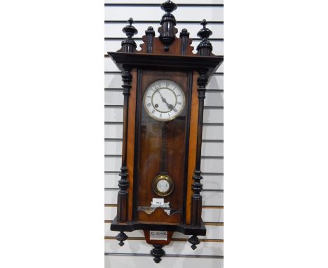 Drop dial wall clock, the enamel dial with Roman numerals and enamel pendulum, in walnut and ebonised architectural case 