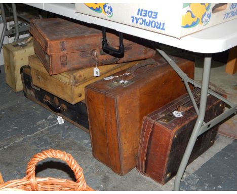 Two pig skin leather suitcases, three brown leather cases and a trunk