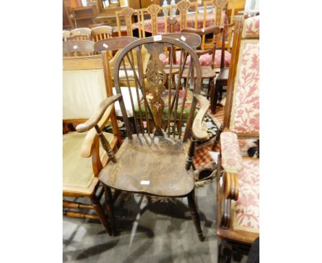19th century stained carvers chair with green velvet upholstery, on circular tapering supports united by bobbin turned stretc
