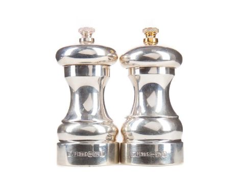 PAIR OF ELIZABETH II SILVER SALT AND PEPPER MILLS,maker A.J. Poole, Birmingham 2003-4, the pepper mill with gilt finial, 10.5