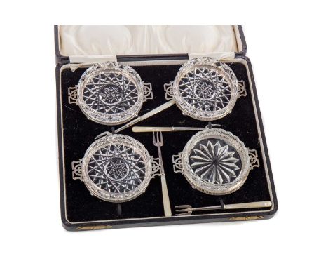 SET OF FOUR GEORGE V SILVER MOUNTED PICKLE DISHES,maker Elkington &amp; Co, Birmingham 1930, all twin-handled with pierced ga