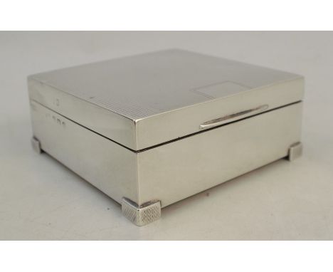 A silver cigarette box, of square form with engine turned decoration, Birmingham 1939, 3.25ins x 3.25ins x 1.5ins