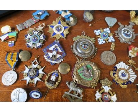 A collection of German gilt metal and enamel badges, to include German veteran medallions,&nbsp; together with various other 