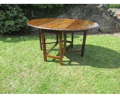 A Georgian style mahogany gate leg table