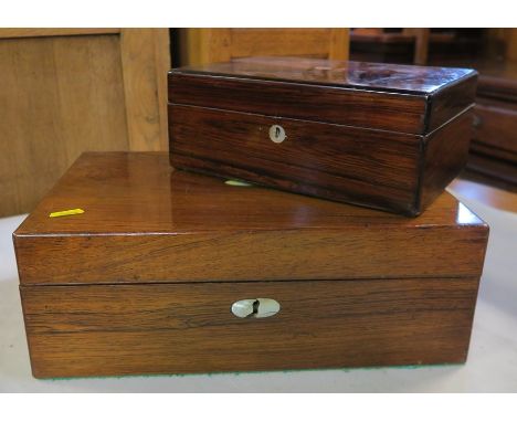 A 19th century rosewood writing box, of rectangular form with mother of pearl roundels, fitted with a writing slope and compa