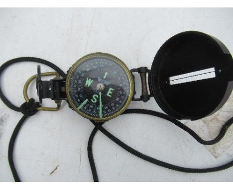 A YCM Japan compass, in black lacquer case, marked Lensatic Compass