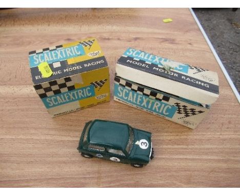 A Scalextric Austin Mini Cooper C76, together with two Scalextric boxes for C/72 BRM and K/1 Go-Kart