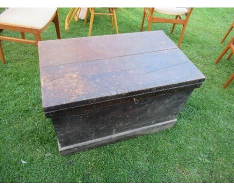 A 19th century oak carpenter's chest, the lid opening to reveal mahogany drawers with brass handles, and sliding saw holder, 