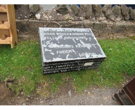 A tin trunk with stencilled words, 30ins x 22ins x height 12ins