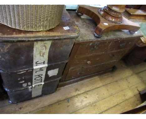 A chest of drawers and a trunk