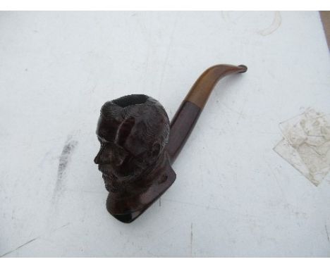 A carved wood pipe, one bowl carved with a bust of Kind Edward
