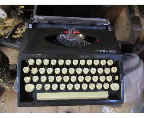 A typewriter together with ribbons