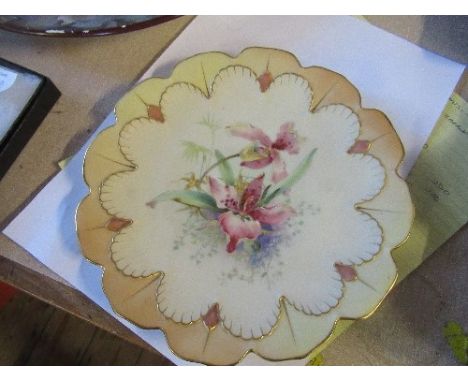 A Royal Worcester plate, decorated with flowers