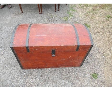 A domed top trunk, with metal bands, 38ins x 18.5ins x height 24ins