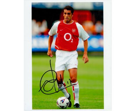 Edu signed 10x8 inch colour photo pictured in action during his playing days with Arsenal. Good condition Est.