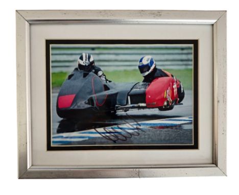 Michael Dunlop signed 10x8 inch framed and mounted colour photo. Good condition Est.
