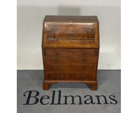 A late 19th century walnut bureauWith fitted interior over four long graduated drawers on bracket feet, 73cm wide; 96cm high