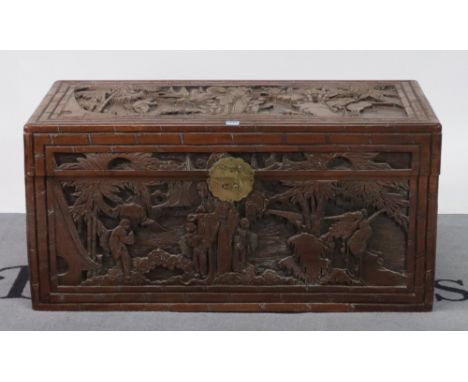 A modern Chinese carved camphor wood trunk100cm wide; 50cm high