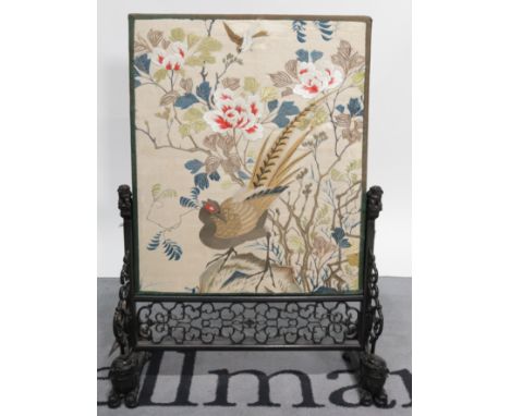 An early 20th century Chinese carved hardwood firescreenHand embroiled silk panel decorated with a pheasant and flowers 62cm 