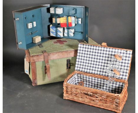 An early 20th century canvas and leather bound wicker trunk (3)45cm wide; 25cm high and another later smaller wicker box and 
