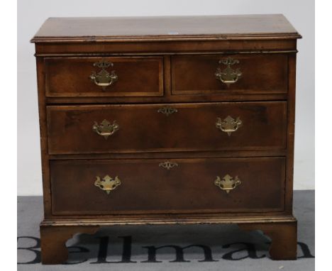 A late Victorian pine and walnut veneer chest of drawersWith two short and two long drawers on bracket feet, 87cm wide; 78cm 