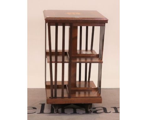 An Edwardian walnut inlaid revolving bookcase47cm wide; 81cm highOld marks and scratches all over, two of the structural upri