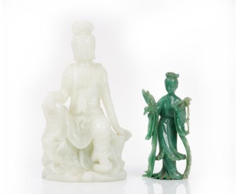 A Chinese moulded glass figure of Guanyin (2)Of pale green tone, the goddess seated on a rocky base, seal and gourd mark to r