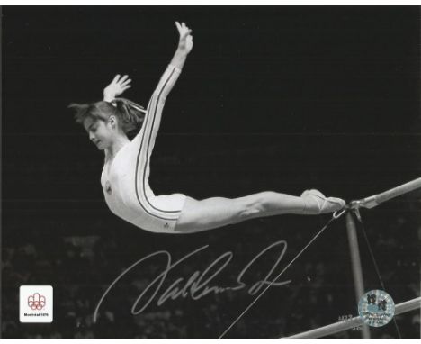 Nadia Comaneci Gymnast Legend signed parallel bar dismount action photo, Nadia Elena Comaneci born November 12, 1961is a Roma