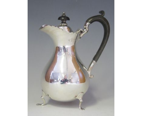 An Edward VII silver hot water jug, maker William Hutton &amp; Sons Ltd, London, 1906, of baluster form raised on three swept