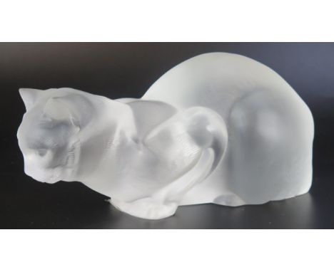 A Lalique frosted glass model of a crouching cat, engraved Lalique, France to the base, 23cm long. 