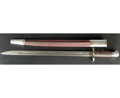 A 1907 pattern British bayonet by Wilkinson, with 43.5cm fullered blade, wood grips, contained in a leather and metal bound s