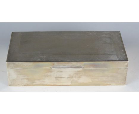 An Elizabeth II silver cigarette box, maker Mappin &amp; Webb, Birmingham, 1962, of rectangular outline with engine turned de