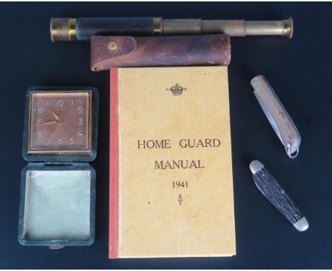 A reprinted Home Guard Manual for 1941, a brass three draw and leather bound telescope, two penknives and a travelling timepi
