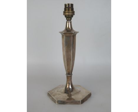 A George V silver table lamp, Hawksworth, Eyre &amp; Co Ltd, Sheffield, 1928, of hexagonal tapering form on a weighted hexago