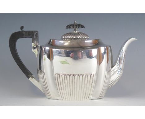 A Victorian silver teapot, maker Harrison Brothers &amp; Howson, Sheffield, 1900, of oval outline, with recessed angles and h