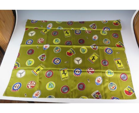 Les Leston, a printed silk scarf, with motor manufacturers badges, includes Ferrari, Lotus, Porsche, Mercedes, B.R.M., Jaguar